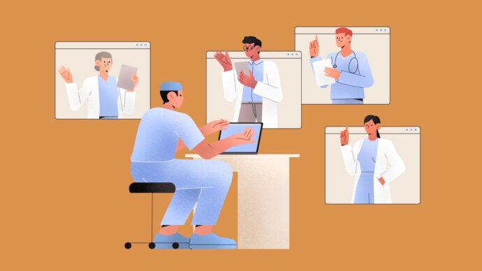 A medical professional in scrubs sits at a desk with a laptop, surrounded by four colleagues in virtual windows, engaging in a video conference about what health information exchange entails.