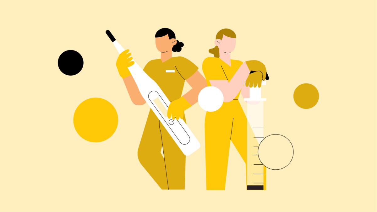 Two people in yellow uniforms, styled in the best scrubs for women, hold oversized medical instruments—one a thermometer and the other a syringe—against abstract circles on a pale yellow backdrop.