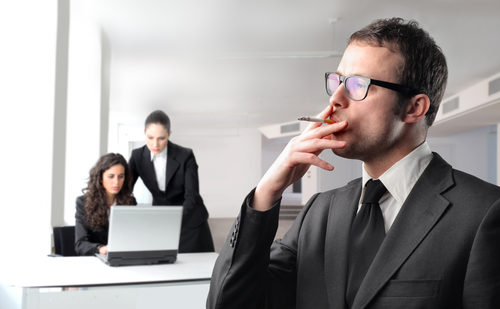 A man in a suit smokes a cigarette in the foreground, seemingly unaware of health incentivization efforts. Meanwhile, two women in business attire work at a desk with a laptop, focused and committed to their tasks.