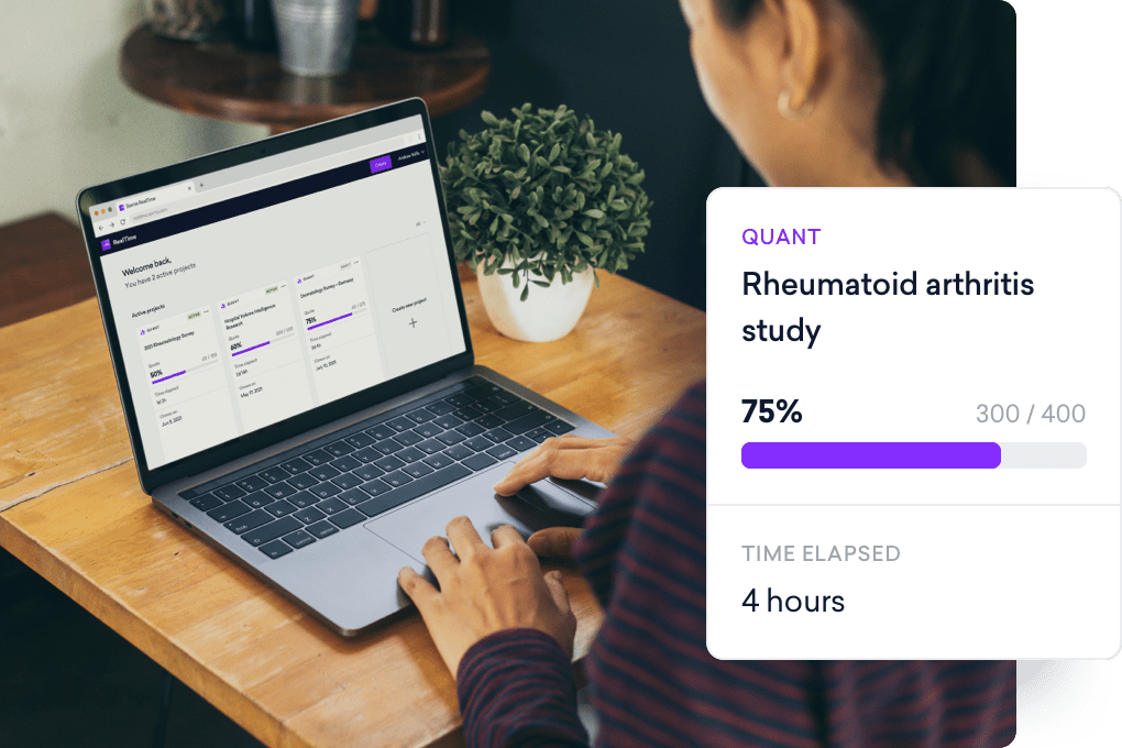 Person working on a laptop showing a rheumatoid arthritis study with a progress bar. A card on the side displays 75% completion and 4 hours elapsed. A plant is on the table.